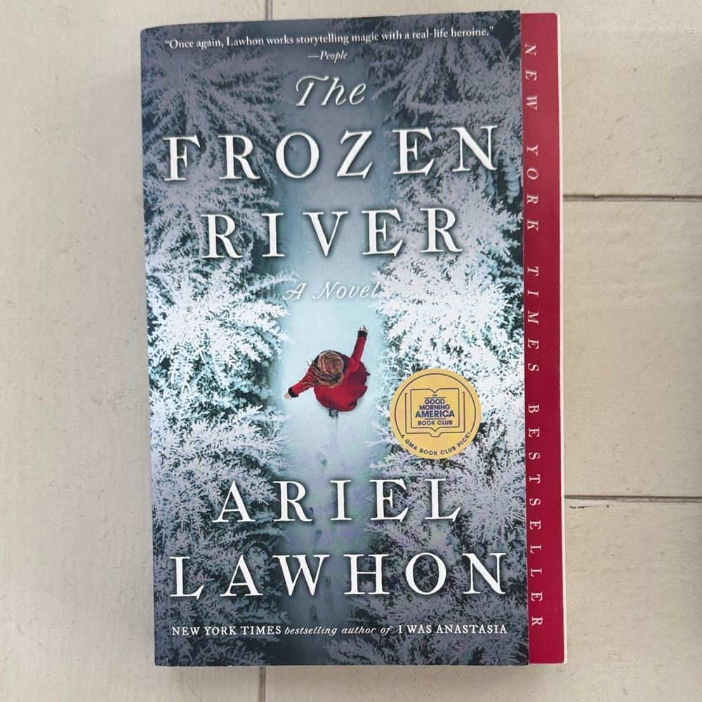 The Frozen River by Ariel Lawhon - Snowy Blue Cover with Red Accent
